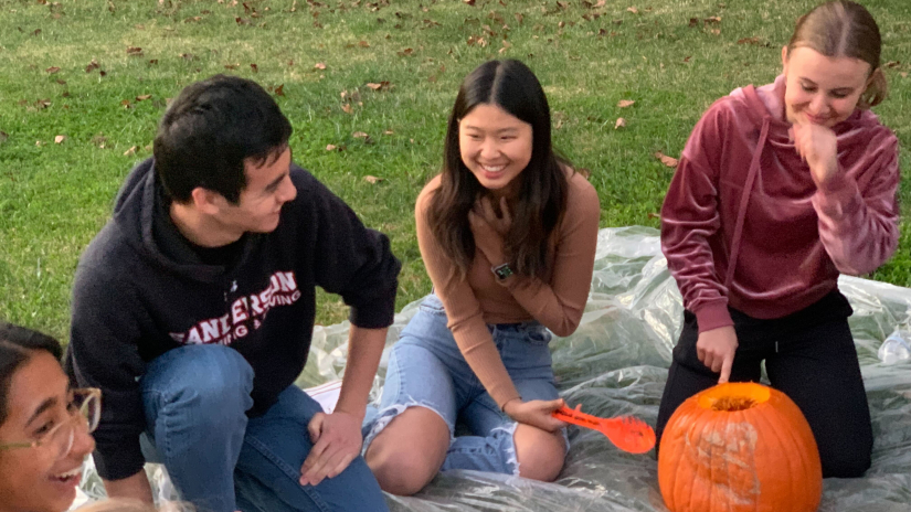 Ethics students carving pumpkins